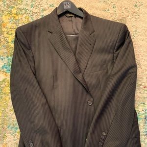 46 Regular, Traditional Cut, Black Pinstripe, Flat front pants and single vent.